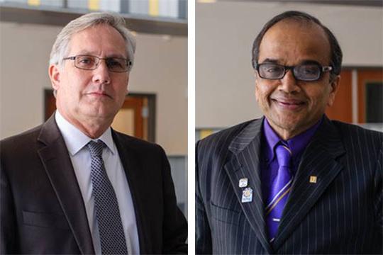 headshots of two men with glasses wearing suits